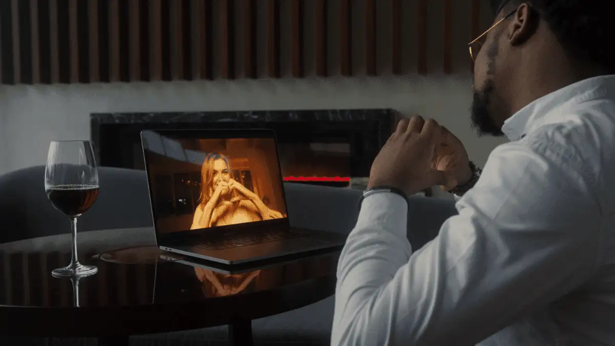A guy video calling a girl with his laptop