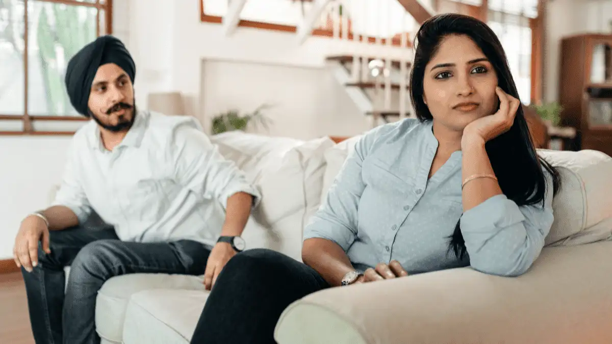 A woman completely lost in her thoughts while discussing with her partner
