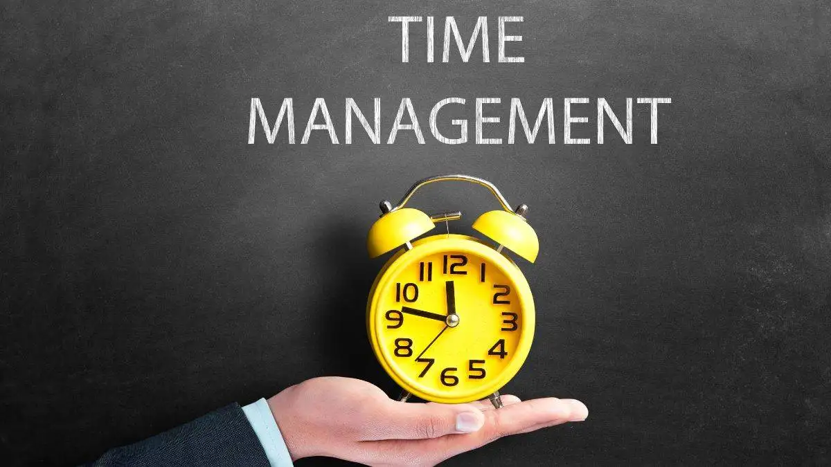  A hand holding a clock for time management