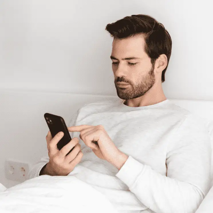A guy reading flirty good morning quotes