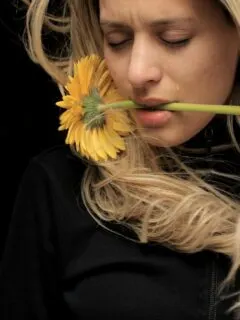 woman in black shirt with yellow hair